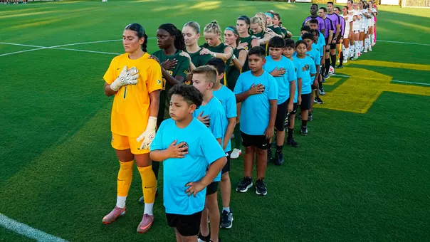 Team national anthem ahead of Texas A&M match