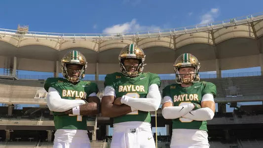 Louis Brown, DJ Lagway and Jacob Redding pose wearing the new throwback uniforms at McLane Stadium