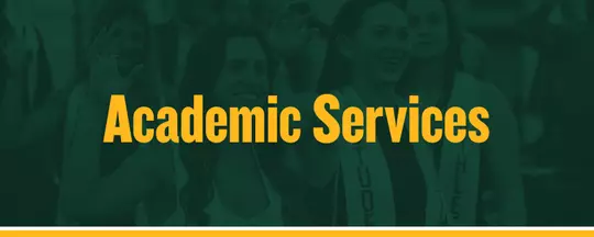 Academic Services in gold text with a photo of two student-athletes holding up a Sic 'Em in the background behind a green overlay