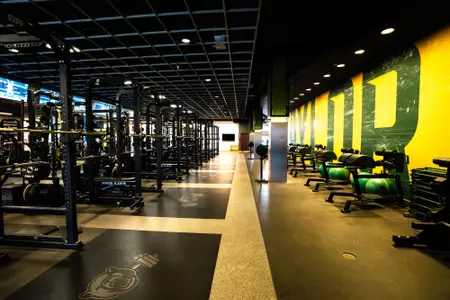 Simpson Athletics and Academic Center Weight Room images with racks of weights and dumbbells and weight benches