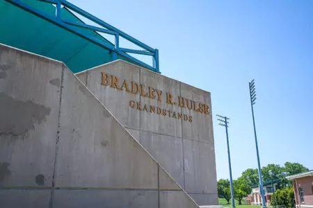 Exterior photos of the Hurd Tennis Center in 2026 featuring the courts, videoboard and grandstand seating