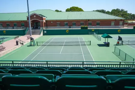 Exterior photos of the Hurd Tennis Center in 2026 featuring the courts, videoboard and grandstand seating