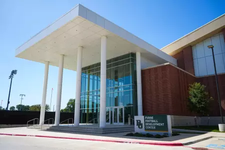 Exterior photos of the Fudge Football Development Center in 2026 from the parking lot