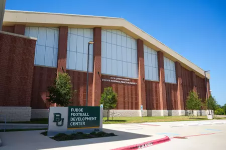 Exterior photos of the Fudge Football Development Center in 2026 from the parking lot