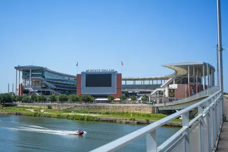 Exterior photos of McLane Stadium in 2026, including the RGIII statue, rear-facing videoboard and Umphrey pedestrian bridge