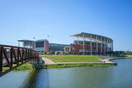Exterior photos of McLane Stadium in 2026, including the RGIII statue, rear-facing videoboard and Umphrey pedestrian bridge