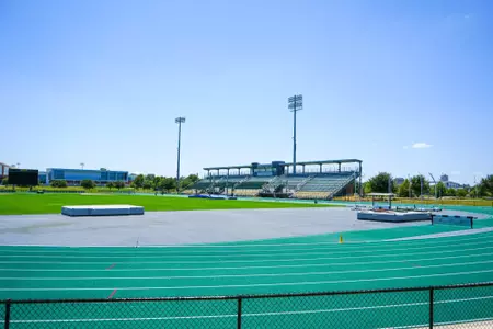 Exterior photos for Clyde Hart Track & Field Stadium in 2026, including the track, grandstands, buildings and Clyde Hart bust