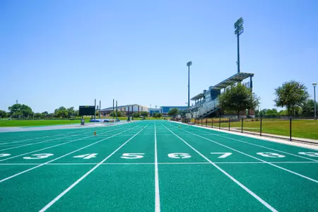 Exterior photos for Clyde Hart Track & Field Stadium in 2026, including the track, grandstands, buildings and Clyde Hart bust