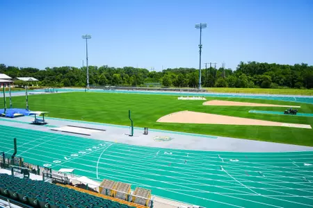 Exterior photos for Clyde Hart Track & Field Stadium in 2026, including the track, grandstands, buildings and Clyde Hart bust