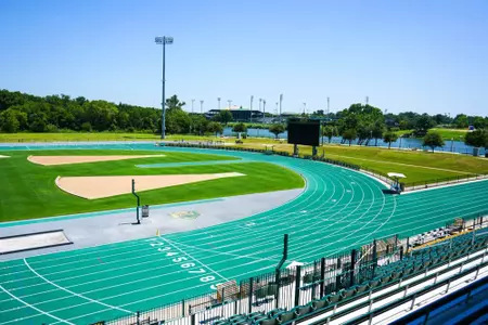 Exterior photos for Clyde Hart Track & Field Stadium in 2026, including the track, grandstands, buildings and Clyde Hart bust