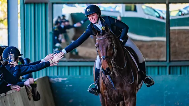 Morgan McCarthy high fiving a teammate in 2025-26