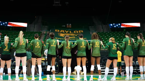 Baylor Volleyball Poses for the national Anthem before a match against UNT