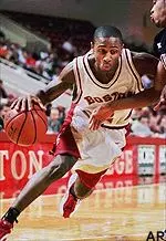 Troy Bell drives baseline past St. Francis' Greg Nunn during the first half of Saturday night's game.