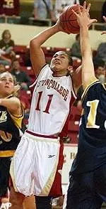 Brianne Stepherson finds room between two La Salle defenders for a shot during the second half at Conte Forum in Newton, Mass.