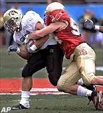 Linebacker Scott Bradley wraps up Colorado tailback Cortlen Johnson during the firt quarter of the Insight.com Bowl.