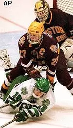 Eagle captain Brendan Buckley<br>battles in front of<br>his net during a<br>scoreless first period.