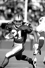 B.C.'s Mike Cloud battles<BR> West Virginia's Amos Zereoue<BR> this weekend.