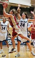 Alissa Murphy drives past<br>Seton Hall's Susan Murray<br>for two of her 14 points.