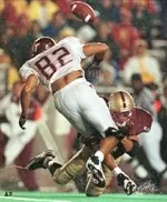 Willie Wright hits<BR>Virginia Tech end<BR>Ricky Hall during<BR>the first half.