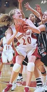 Boston College's Jamie Cournoyer looks to the basket as she is guarded by Providence's Jen Gombotz in the first half Saturday.