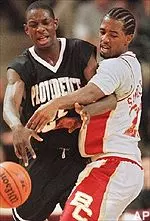 Xavier Singletary battles for a loose ball with Providence's Romuald Augustin during the first half of Saturday's game.