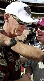 Outgoing Arizona State head coach Bruce Snyder, right, meets head coach Tom O'Brien at mid-field following Boston College's victory at the Aloha Bowl.