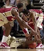 Boston College forward Uka Agbai and guard Kenny Walls try to pry the ball away from Vanderbilt's Sam Lekwauwa on Sunday.