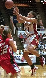Brianne Stepherson looks to pass to the inside as Nebraska's Melody Peterson and Nicole Kubik defend in the first half of their NCAA tournament game Friday.