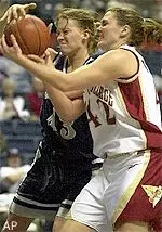 Maureen Magarity battles for a rebound with Georgetown's Nathalie Bourdereau during the first half of Sunday's game.