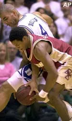 Duke's Carlos Boozer, left, battles Boston College's Ryan Sidney, right, for a loose ball in the first half Tuesday.