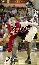 Boston University forward Stijn Dhondt can't get past BC forward Uka Agbai in the second half.