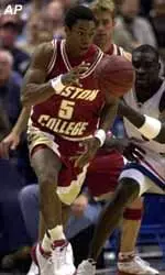 Ryan Sidney and UConn's Robert Swain chase a loose ball in the first half of Tuesday night's Big East battle in Hartford.