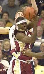 Boston College Xavier Singletaryhas his shot blocked by Notre Dame forward Troy Murphy during action Wednesday Feb. 21, 2001 in South Bend, Ind
