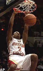 Troy Bell dunks for two of his 32 points against USC in the second round of the NCAA tournament.