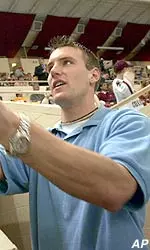 Scott Clemmensen signs autographs for the fans at Conte Forum Monday, just before he and the rest of the team were honored for winning the 2001 NCAA hockey championship.