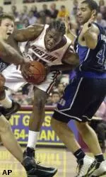 Uka Agbai drives to the basket as Carlos Boozer and Mike Dunleavy defend.