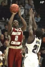 Troy Bell shoots over Villanova's Reggie Bryant during the first half, Wednesday.