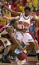 Jermaine Watson fends off Iowa State's Tim Barnes during the first half.