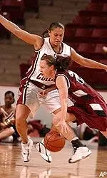Brianne Stepherson tries to defend Harvard's Dirkje Dunham's drive during the first half.