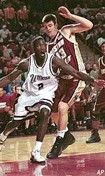 Nate Doornekamp slides into defensive position against UMass in the first half.