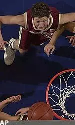 Kim Mackie goes for a rebound during first half action, Sunday.