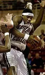 Ryan Sidney, right, grabs a rebound as he collides with teammate Nate Doornekamp during the first half, Sunday.