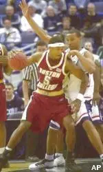 Ryan Sidney backs down UConn's Caron Butler during BC's 79-77 OT loss, Saturday