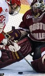 Boston University forward Justin Maiser tries to get his stick on the puck as Matti Kaltiainen makes the save, Monday night.