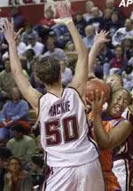 Syracuse guard Jazmine Wright tries to squeeze between Kim Mackie and Nicole Conway during the first half.