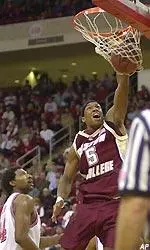 Ryan Sidney (5) dunks for two for two of his 24 points.