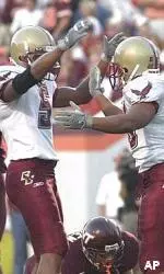 Derrick Knight is congratulated by Grant Adams after one of his two touchdowns on the day. Knight became Boston College's all-time leading rusher with his 197-yard performance at Virginia Tech.
