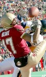 Joel Hazard and West Virginia's Adam Jones battle for the ball during the first quarter.