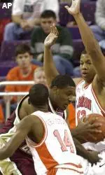 Craig Smith drives for the basket between Clemson's Chris Hobbs (43) and Chey Christie (14) in the first half.