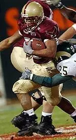 Running back Derrick Knight is tackled by Colorado State's Benny Mastropaolo, center, and Andre Sommersell during the first quarter of the San Francisco Bowl Wednesday night.